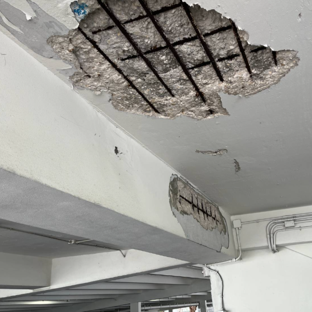 exposed rebar in condo parking garage